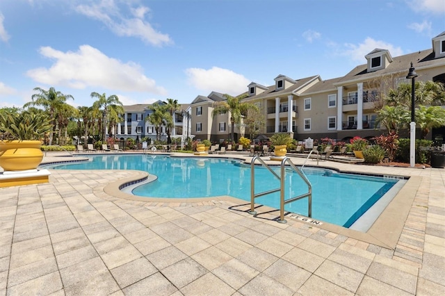 view of swimming pool with a patio area