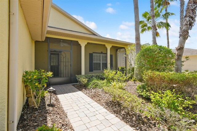 196 Ventana Dr, Kissimmee, FL 34759 - view of exterior entry with stucco siding