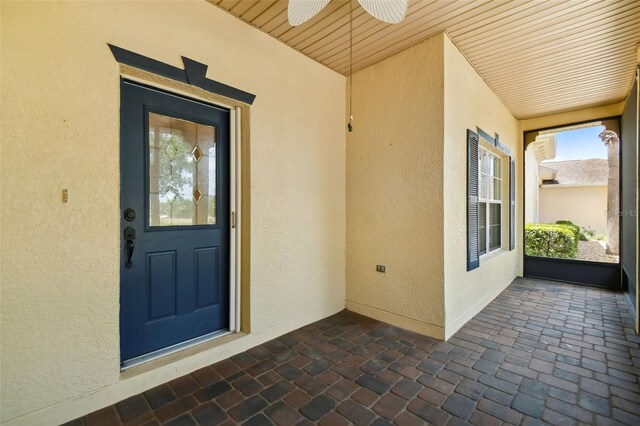 196 Ventana Dr, Kissimmee, FL 34759 - entrance to property with stucco siding and ceiling fan
