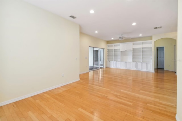 unfurnished living room with light hardwood / wood-style floors and ceiling fan