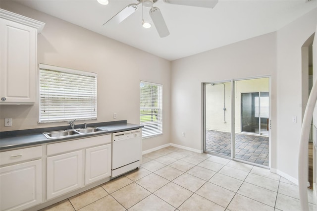 kitchen with white cabinets, ceiling fan, dishwasher, light tile patterned flooring, and sink