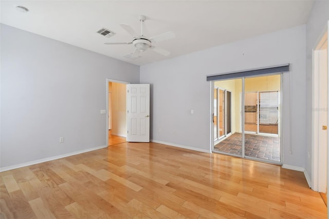 empty room with light hardwood / wood-style flooring and ceiling fan