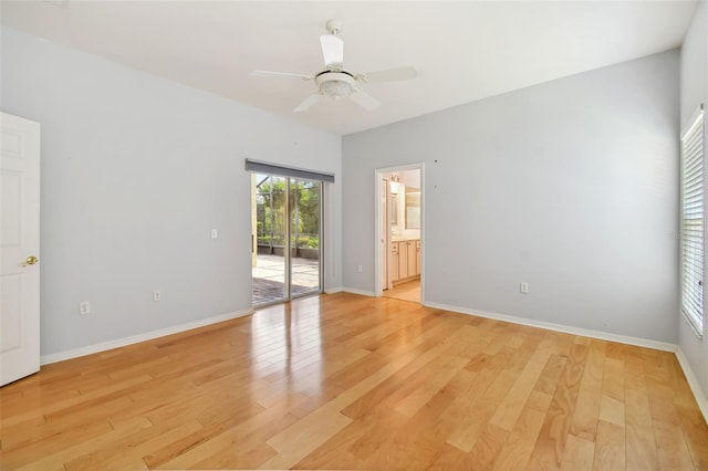 empty room featuring light wood-type flooring and ceiling fan