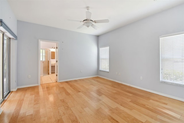 unfurnished bedroom with light hardwood / wood-style floors, connected bathroom, and ceiling fan