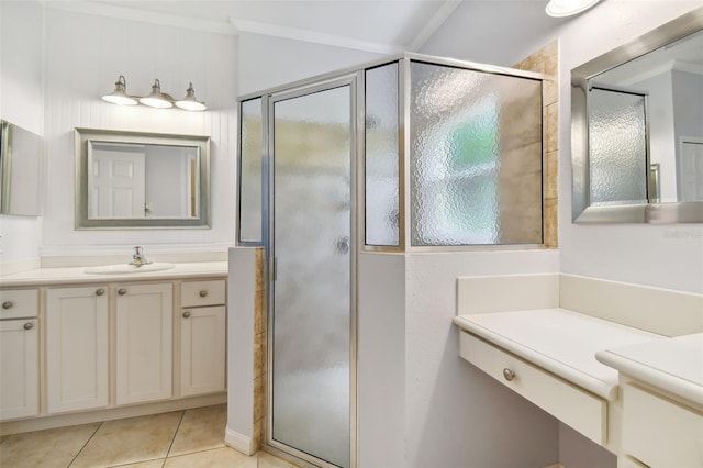 bathroom featuring vanity, crown molding, tile patterned flooring, and a shower with door