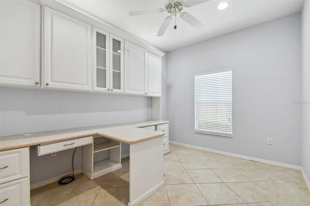 196 Ventana Dr, Kissimmee, FL 34759 - unfurnished office featuring built in desk, light tile patterned flooring, and a ceiling fan