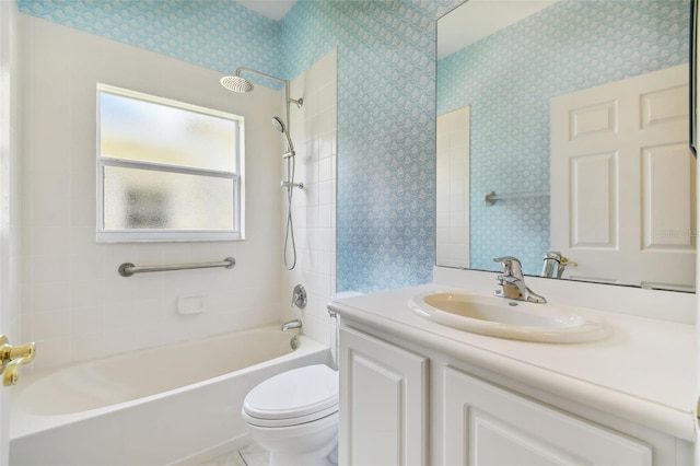 full bathroom with vanity, toilet, and tiled shower / bath combo