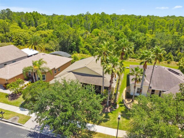 196 Ventana Dr, Kissimmee, FL 34759 - view from above of property with a forest