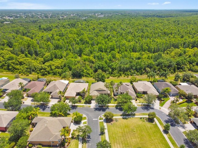 196 Ventana Dr, Kissimmee, FL 34759 - aerial view of residential area featuring a heavily wooded area