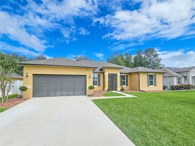 ranch-style home featuring a garage and a front lawn