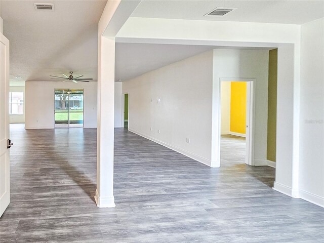 spare room with dark hardwood / wood-style flooring and ceiling fan