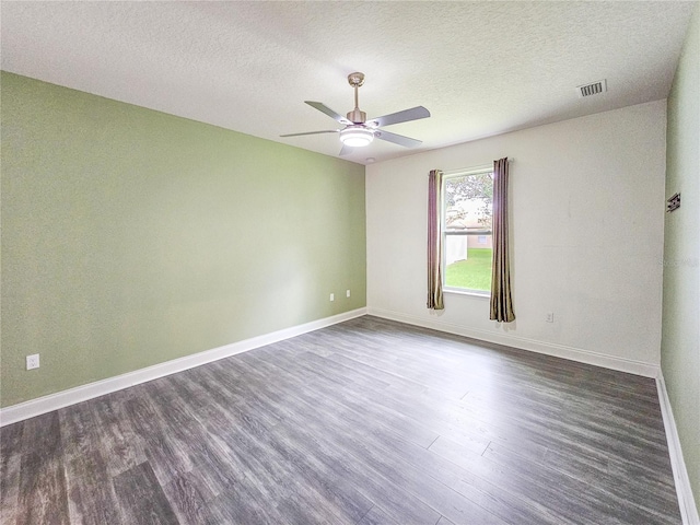 unfurnished room featuring ceiling fan, a textured ceiling, and dark hardwood / wood-style flooring