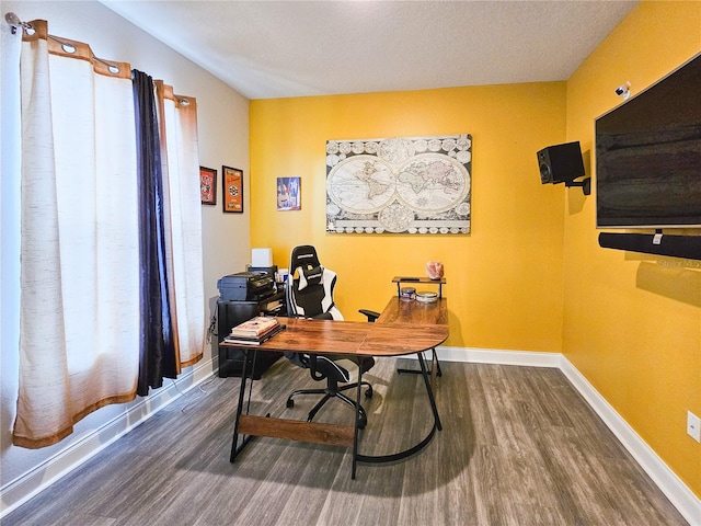 office featuring wood-type flooring and a textured ceiling