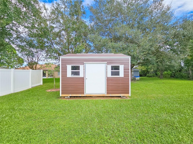 view of outdoor structure featuring a yard