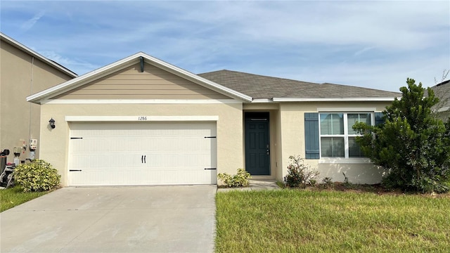 ranch-style home with a front yard and a garage