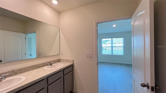 bathroom featuring vanity and wood-type flooring