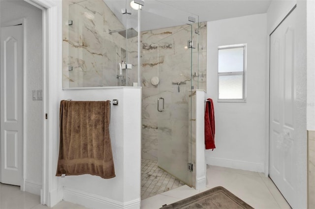 bathroom featuring tile patterned floors and an enclosed shower