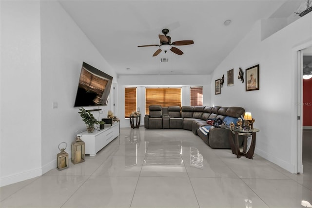 living room featuring ceiling fan and lofted ceiling