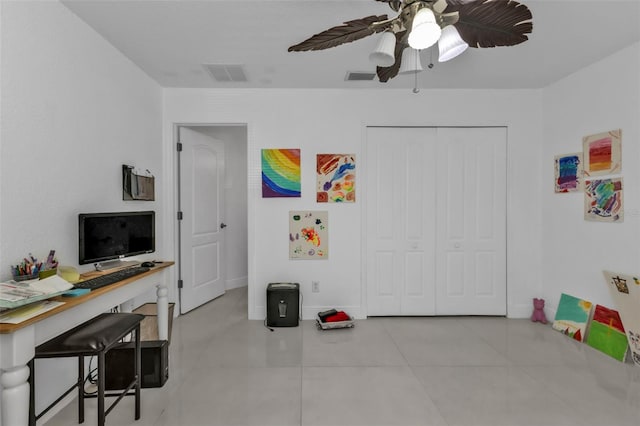 rec room with ceiling fan and light tile patterned floors