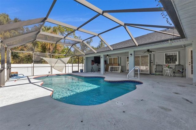 view of pool with a patio area, ceiling fan, and a lanai