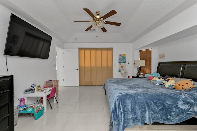 tiled bedroom with ceiling fan