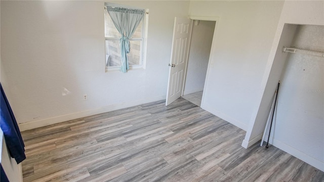 unfurnished bedroom with light hardwood / wood-style floors