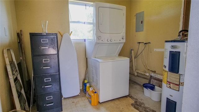 washroom featuring electric panel, stacked washer and dryer, and water heater