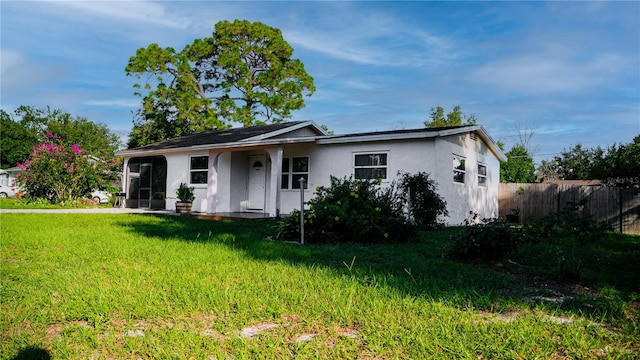 ranch-style house with a front yard