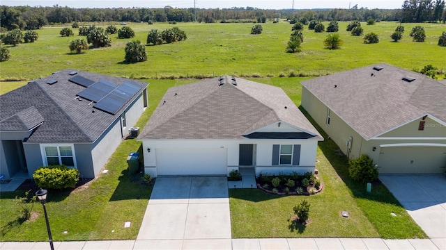 birds eye view of property with a rural view