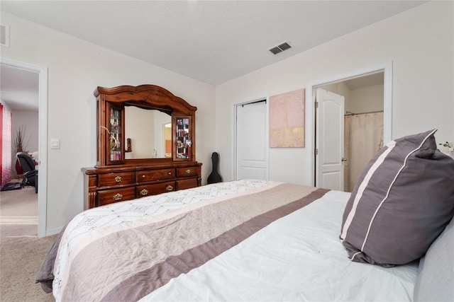 carpeted bedroom with a textured ceiling