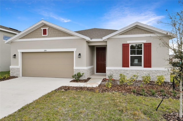 view of front of property featuring a garage and a front lawn