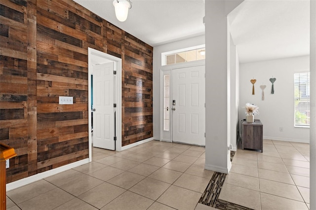 tiled entrance foyer with wood walls