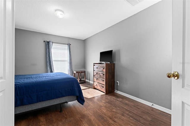 bedroom featuring dark hardwood / wood-style floors