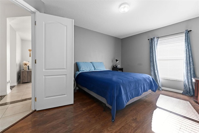 bedroom featuring dark hardwood / wood-style floors