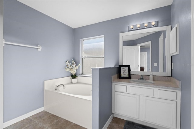 bathroom featuring vanity, a bathing tub, and tile patterned floors