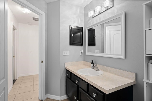 bathroom with tile patterned flooring and vanity