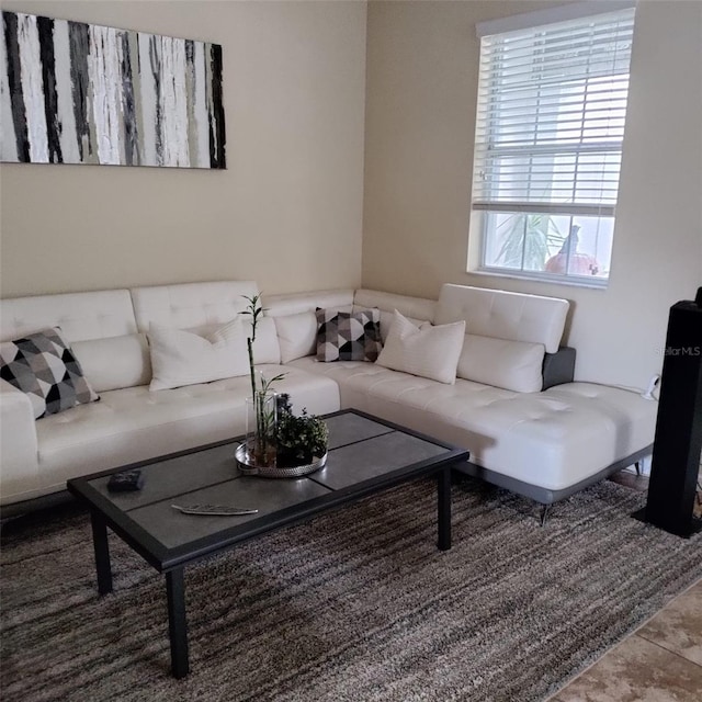 living room with tile patterned flooring