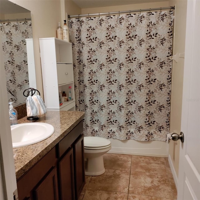 full bathroom with vanity, shower / bath combo, toilet, and tile patterned floors