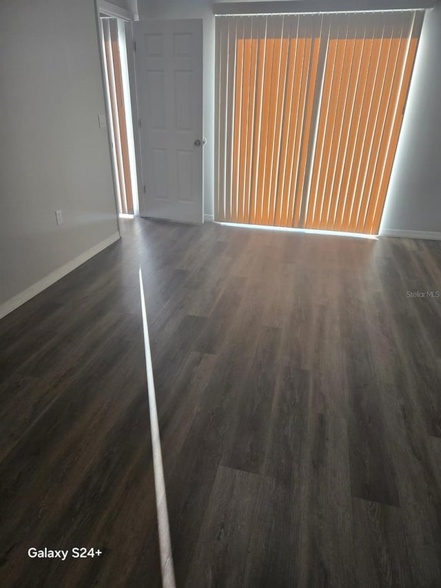 interior space with dark wood-type flooring