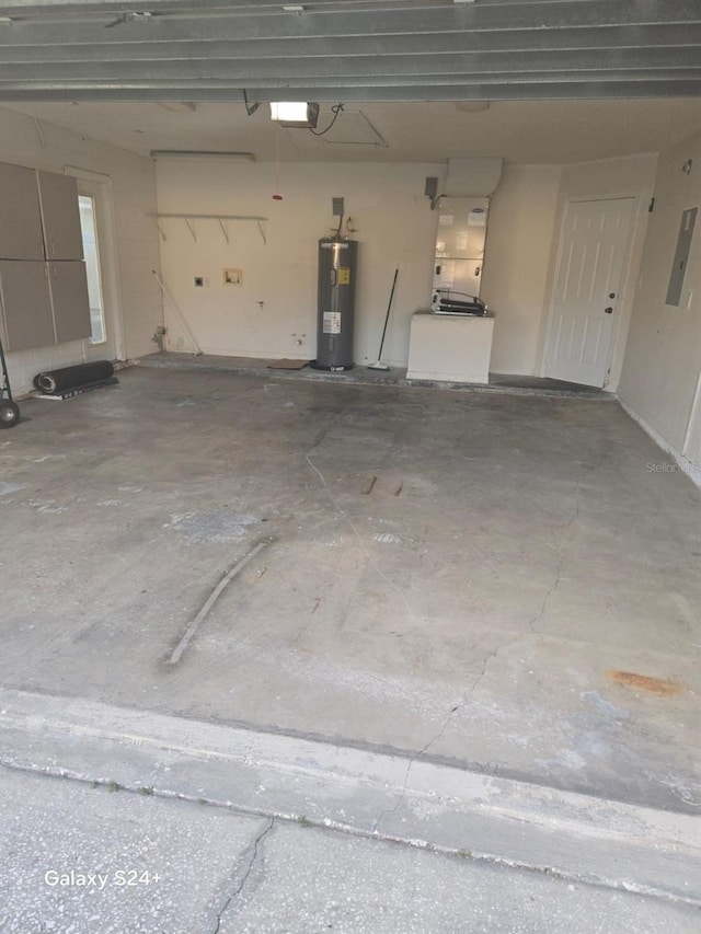 garage featuring water heater and a garage door opener