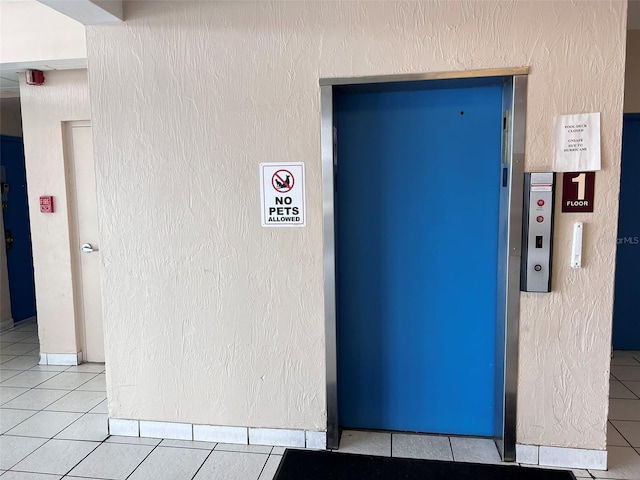 details with tile patterned floors and elevator