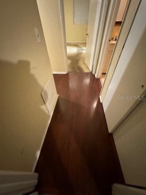 hallway featuring dark wood-type flooring