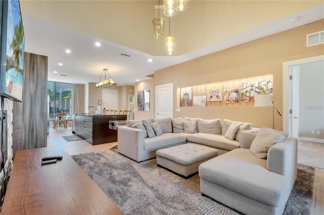 living room featuring sink, a wealth of natural light, and hardwood / wood-style floors