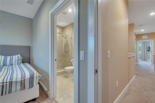 carpeted bedroom featuring connected bathroom