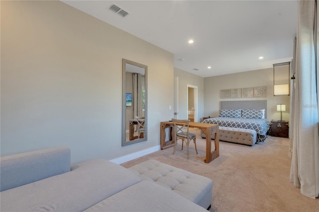 bedroom featuring light carpet