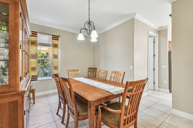 dining area featuring ornamental molding, a chandelier, and light tile patterned floors