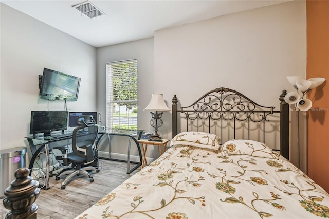 bedroom featuring hardwood / wood-style flooring