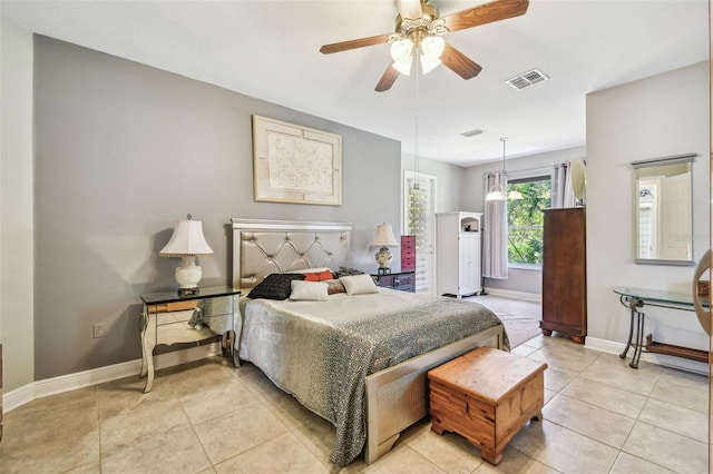 tiled bedroom with ceiling fan