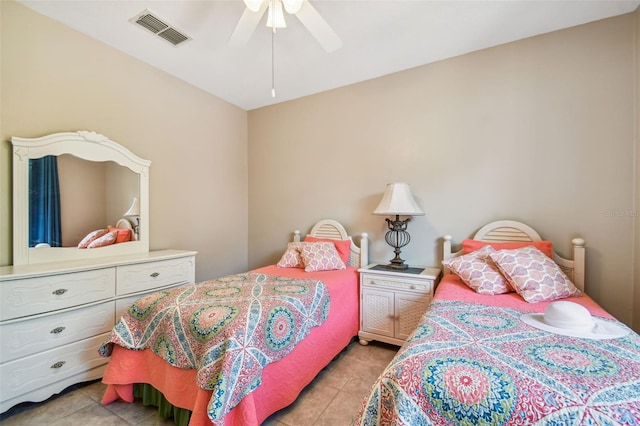 tiled bedroom with ceiling fan