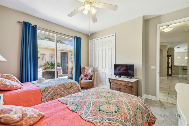 tiled bedroom with a closet, access to outside, and ceiling fan